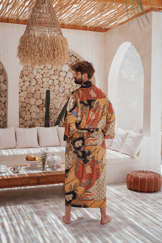 Back view of man wearing the Agni men’s kimono robe – elegant satin dressing gown with batik-inspired pattern.