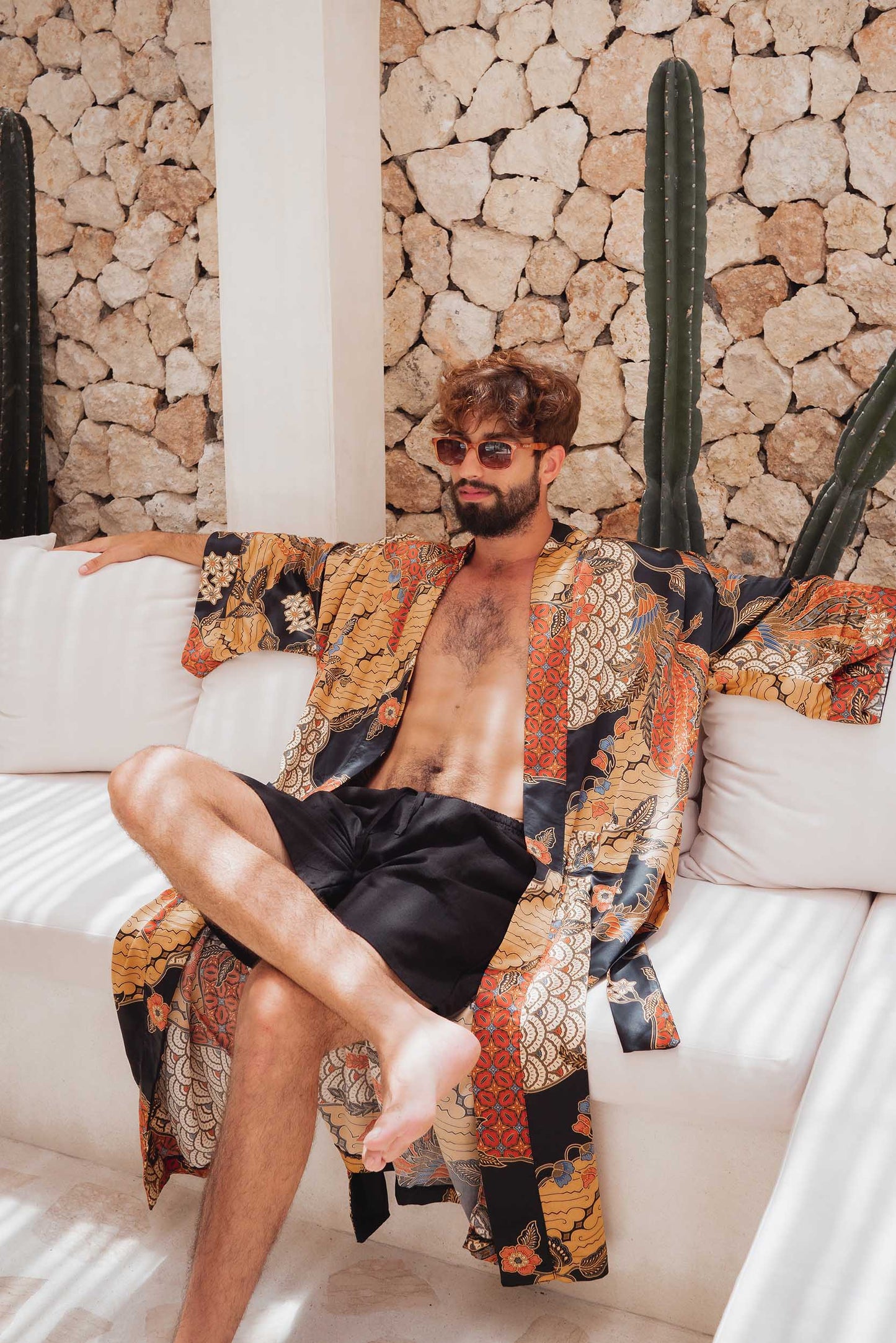 Man sitting in the Agni kimono robe – luxury dressing gown handmade in Bali.