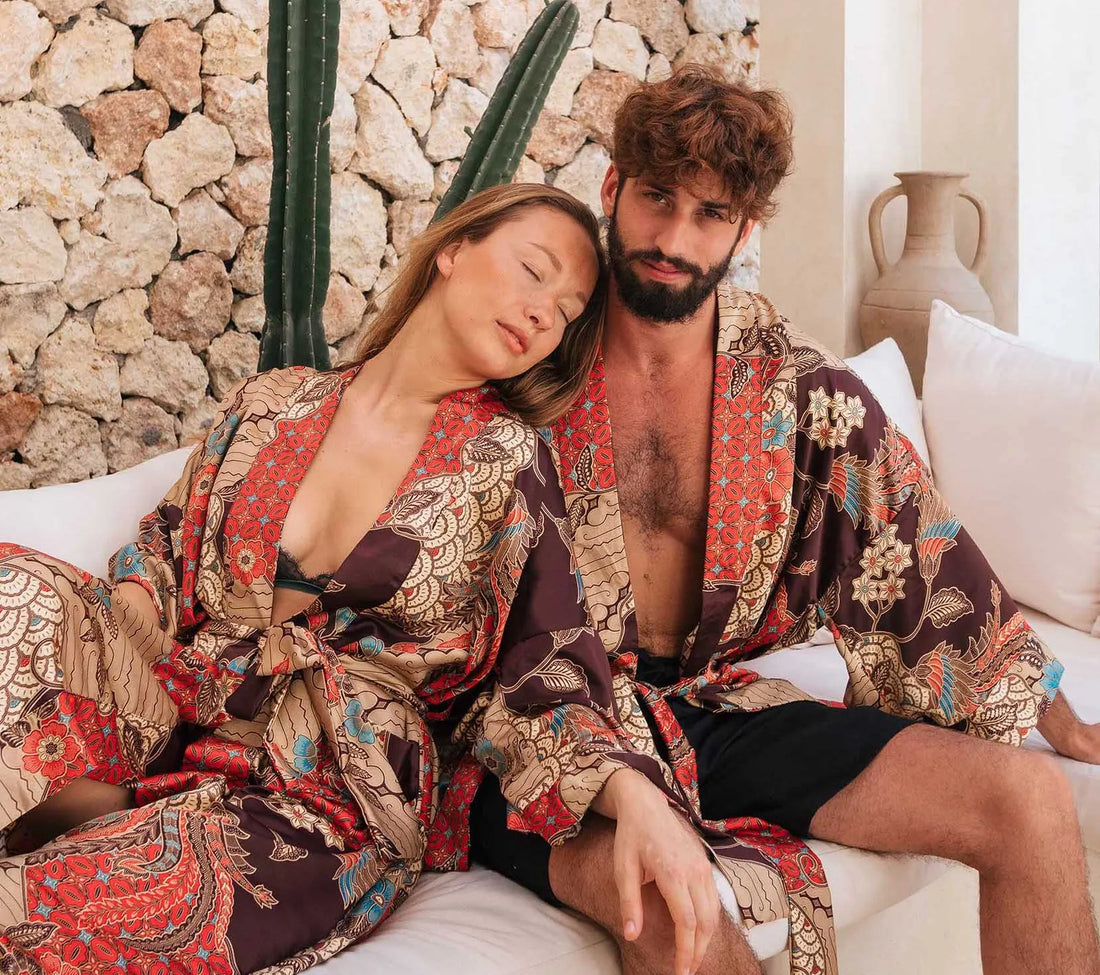 Couple wearing mens and womens kimono robes. Long satin dressing gowns handmade in Bali is a perfect gift for birthdays, anniversaries or other special occasion.