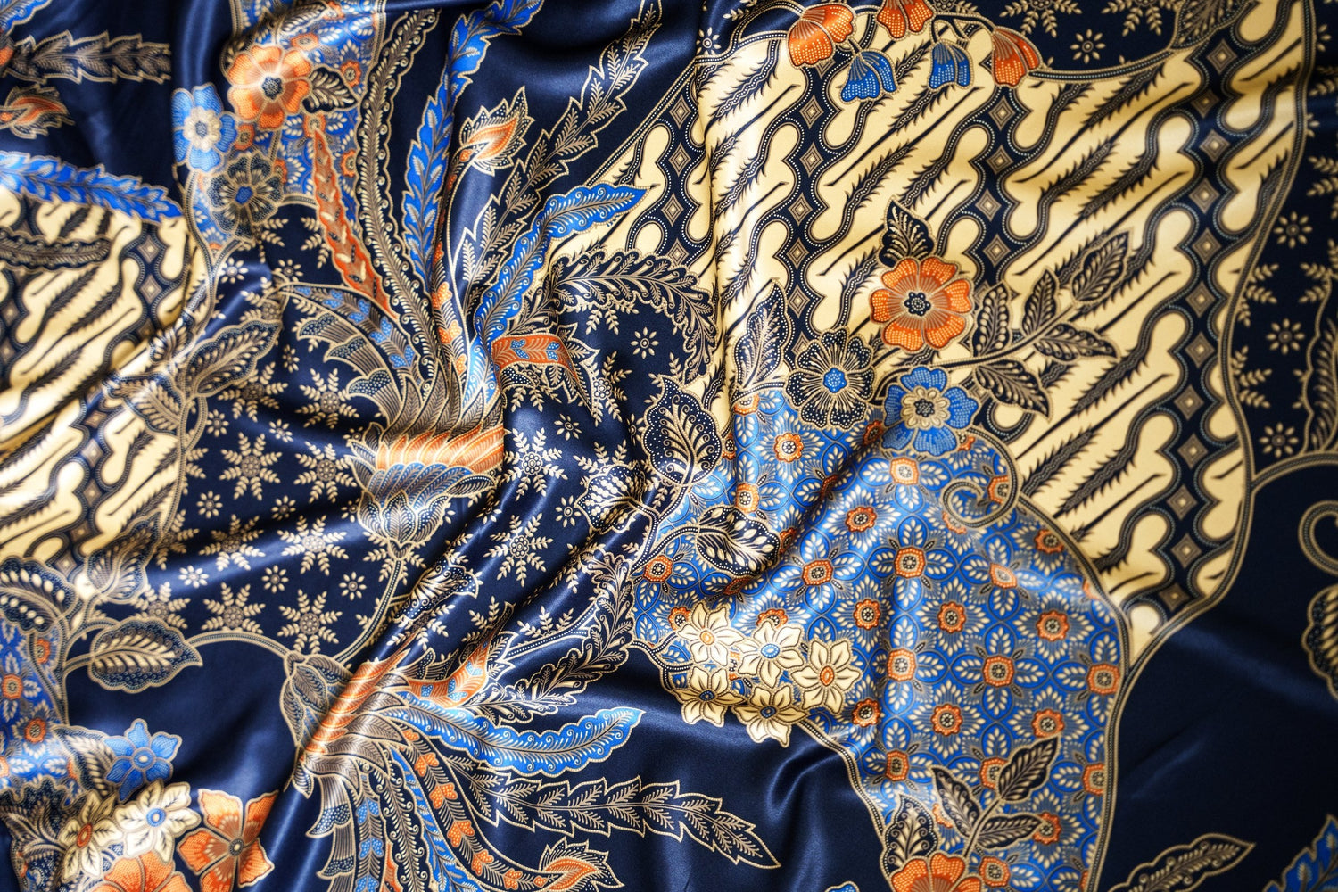 a close up of indonesian batik print on a satin fabric