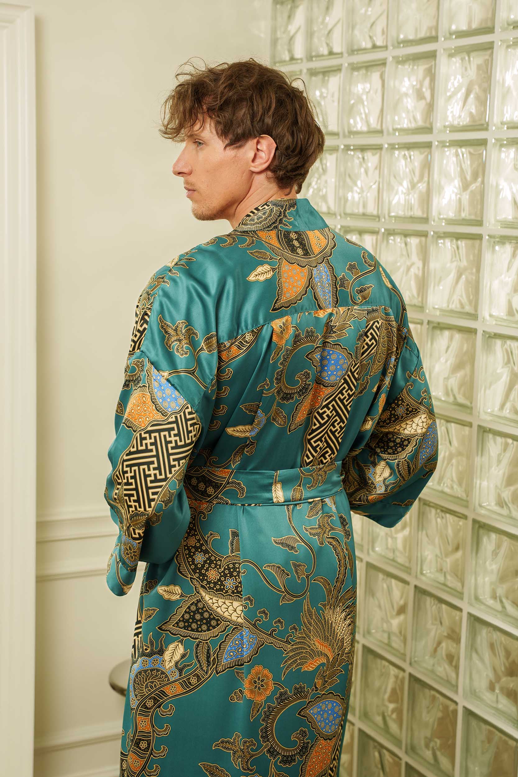 Back view of Lautan men’s kimono robe – teal satin with detailed ocean-inspired pattern.