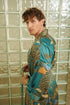Side view of Lautan robe – elegant teal satin kimono robe for men.