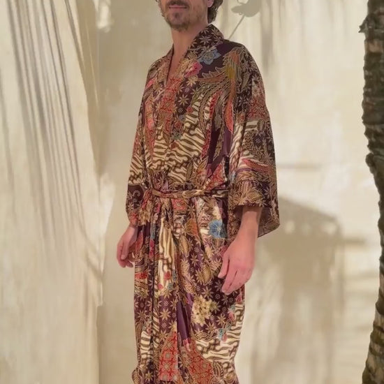 man wearing satin kimono robe in burgundy color
