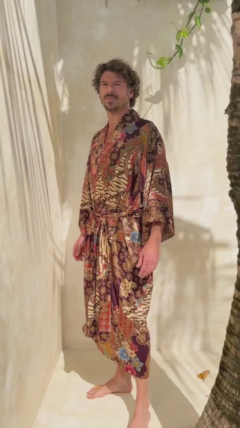 man wearing satin kimono robe in burgundy color