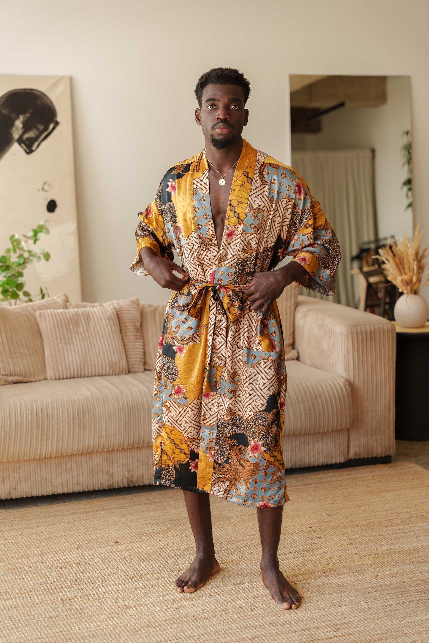 Man wearing Toré Sorga kimono robe – luxury satin dressing gown with pockets and belt.