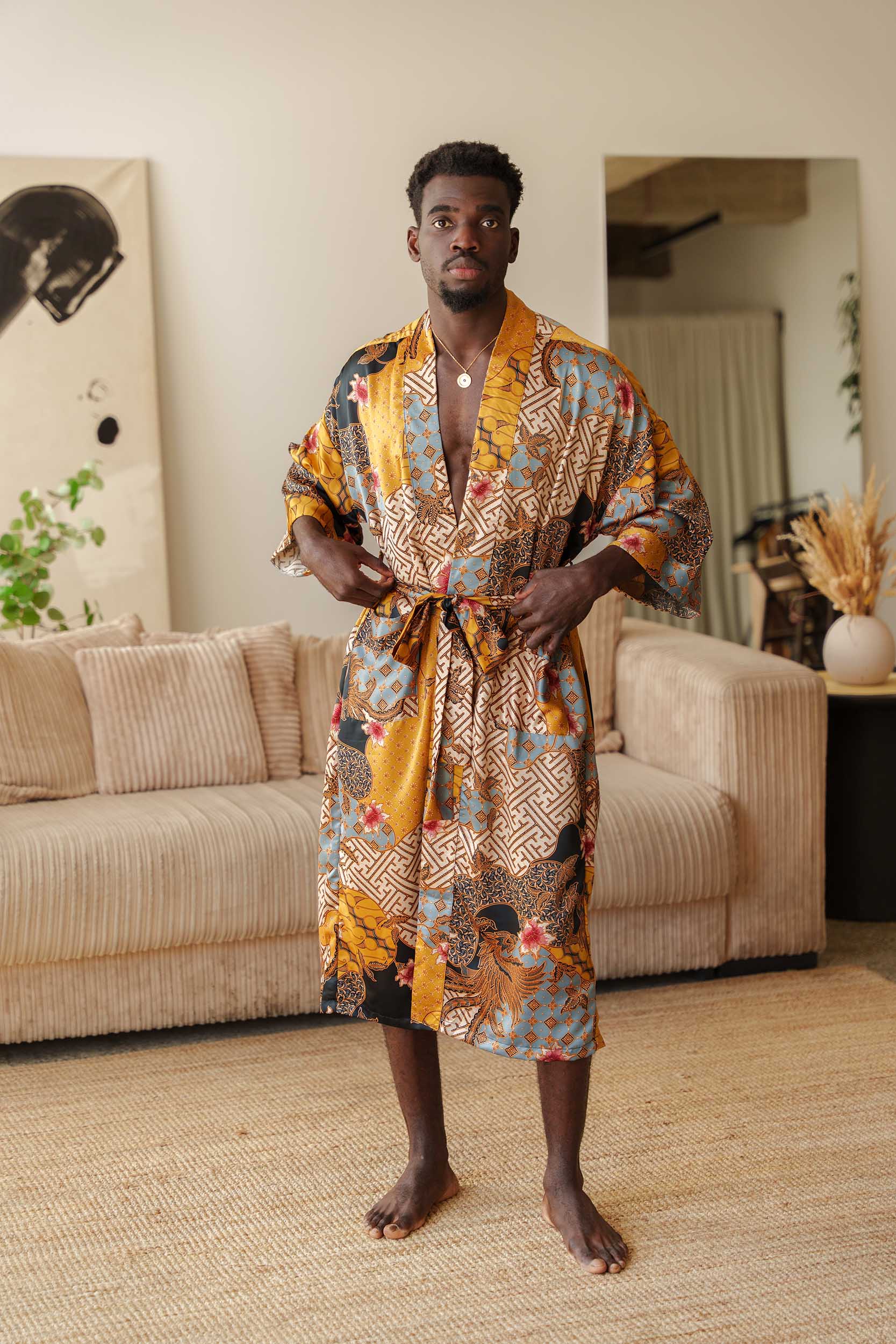 Man wearing Toré Sorga kimono robe – luxury satin dressing gown with pockets and belt.