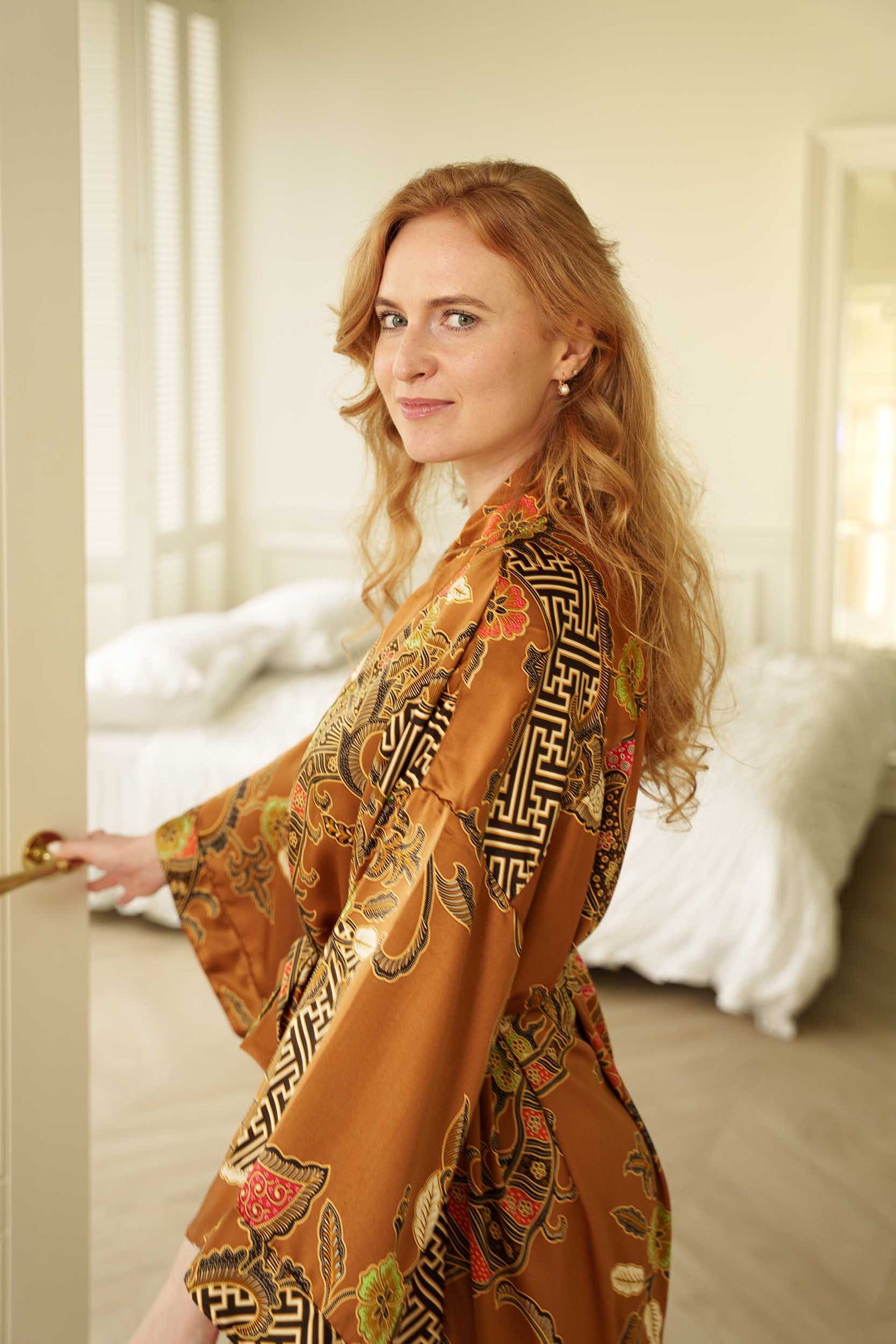 Side view of Surya robe – elegant long satin kimono for women.