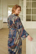 Back view of Toré Angkasa women’s kimono robe – elegant night-sky batik design in navy and turquoise tones.