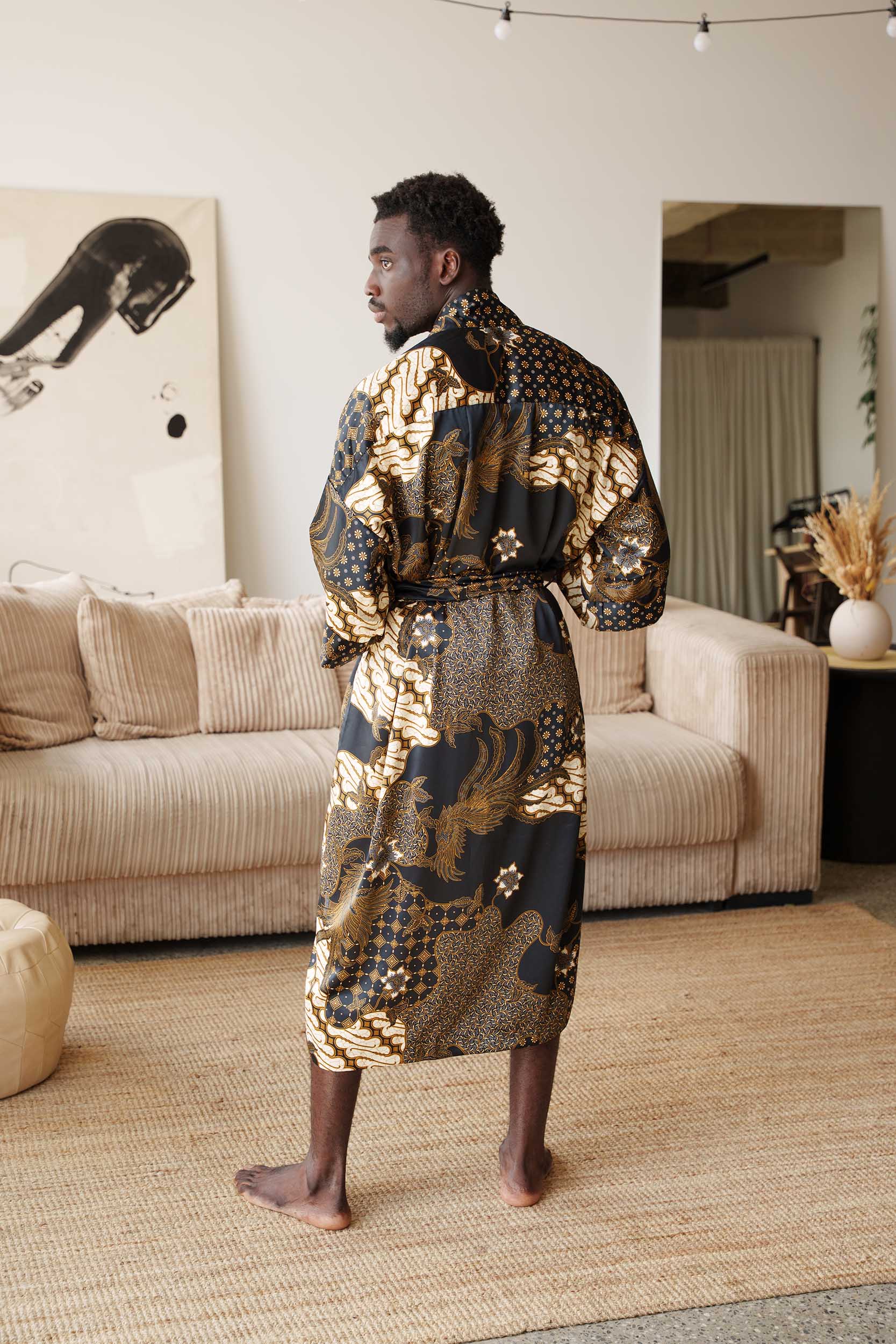 Back view of Toré Kencana robe – men’s black and gold satin kimono with intricate Indonesian motifs.