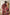 Couple wearing matching Toré Sekar kimono robes – red satin dressing gowns inspired by Balinese artistry.