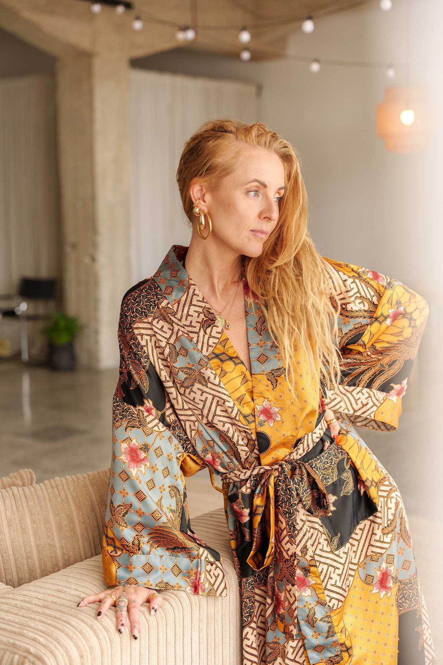 Woman wearing Toré Sorga kimono robe – luxury dressing gown handmade in Bali.
