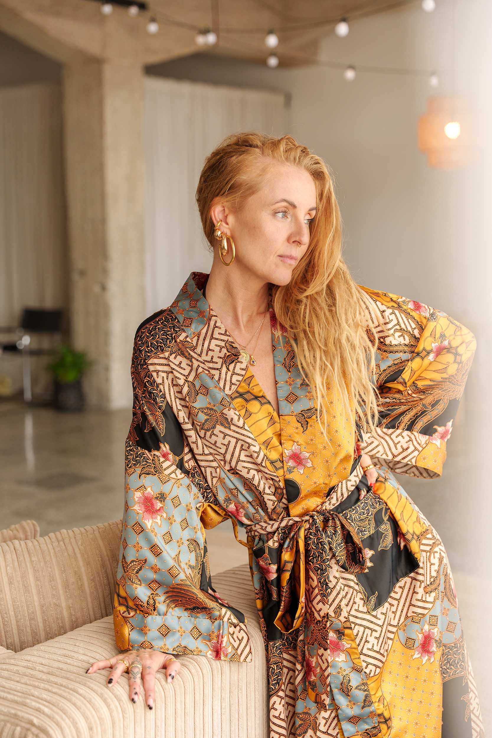Woman wearing Toré Sorga kimono robe – luxury dressing gown handmade in Bali.