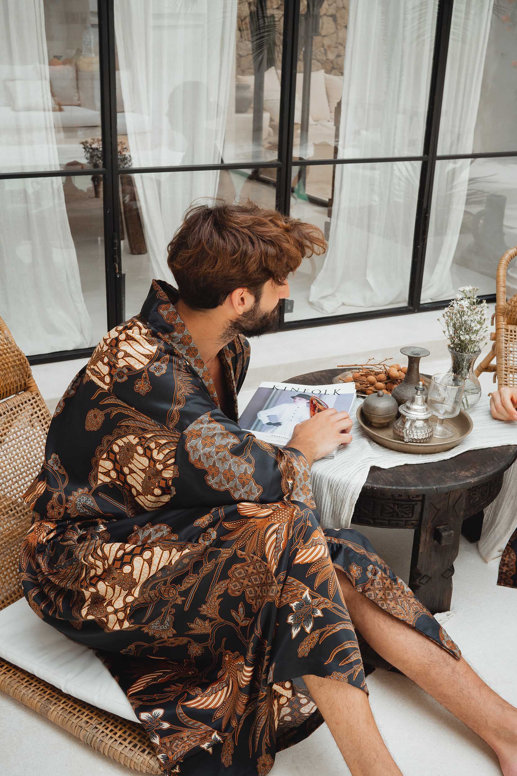 Side view of Toré Svarna men’s robe – luxury satin kimono with Indonesian batik motifs.